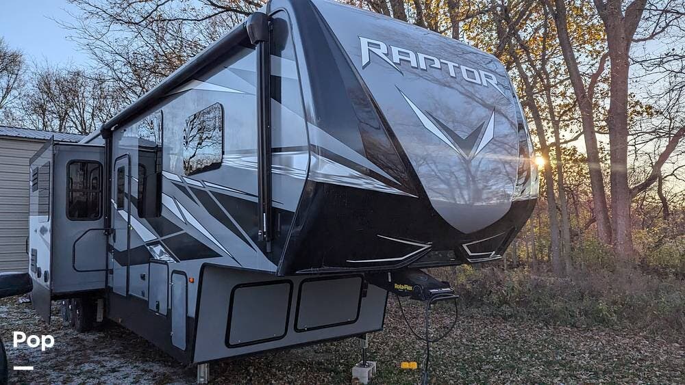 Call now about this 2021 Keystone Raptor 413! 2021 Keystone Raptor 413 - Used Toy Hauler For Sale by Pop RVs in Marion, Indiana features Slideout, Awning, Leveling Jacks, Generator, Air Conditioning