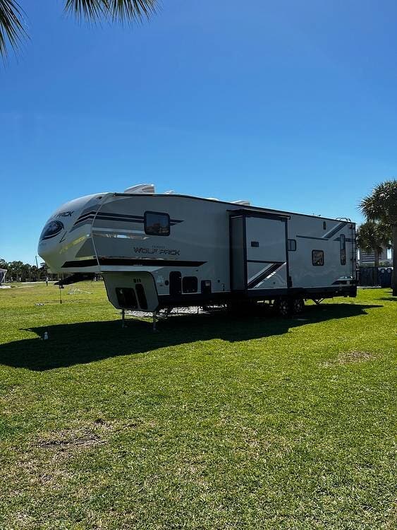 Call now about this 2020 Forest River Wolf Pack 325PACK13! 2020 Forest River Wolf Pack 325PACK13 - Used Toy Hauler For Sale by Pop RVs in Clearwater, Florida features Awning, Slideout, Generator, Air Conditioning, Leveling Jacks