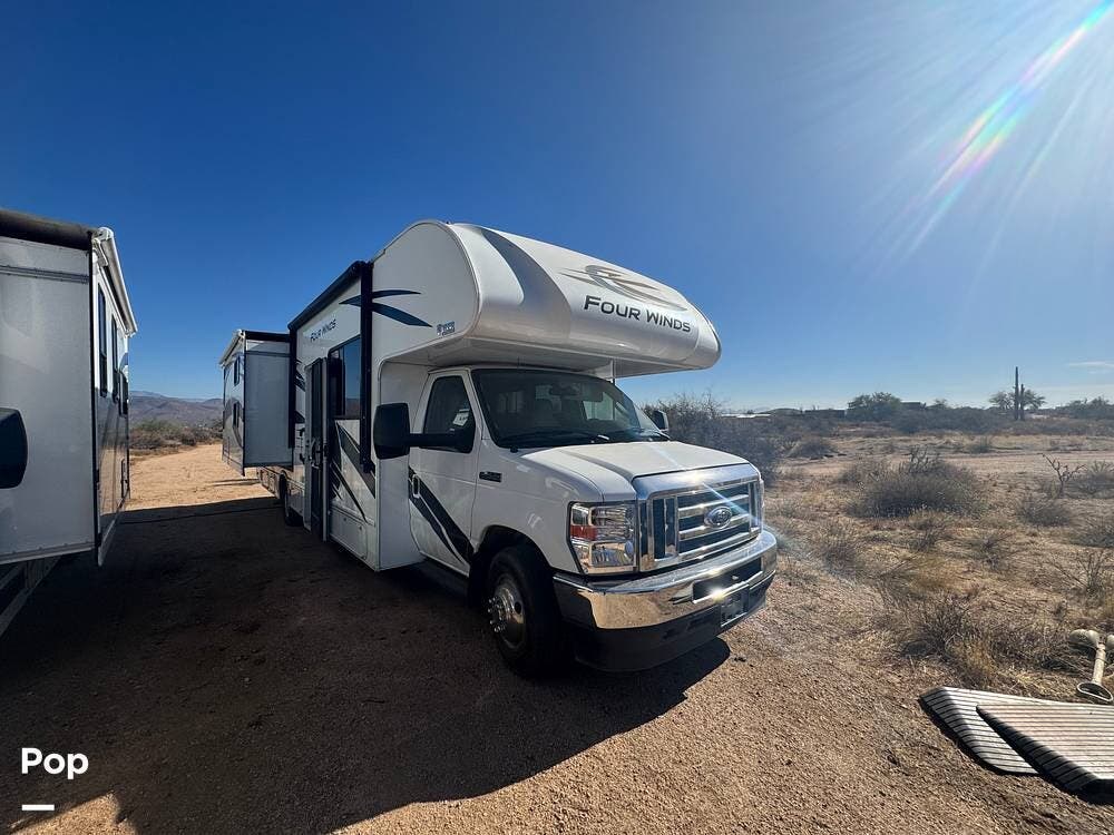Call now about this 2022 Thor Motor Coach Four Winds 30D! 2022 Thor Motor Coach Four Winds 30D - Used Class C For Sale by Pop RVs in Rio Verde, Arizona features Slideout, Air Conditioning, Generator, Awning