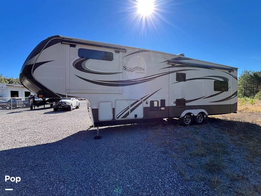 Call now about this 2015 Grand Design Solitude 325X! 2015 Grand Design Solitude 325X - Used Fifth Wheel For Sale by Pop RVs in Saraland, Alabama features Slideout, Air Conditioning, Awning, Leveling Jacks