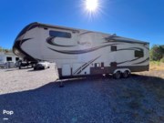 Call now about this 2015 Grand Design Solitude 325X! 2015 Grand Design Solitude 325X - Used Fifth Wheel For Sale by Pop RVs in Saraland, Alabama features Slideout, Air Conditioning, Awning, Leveling Jacks