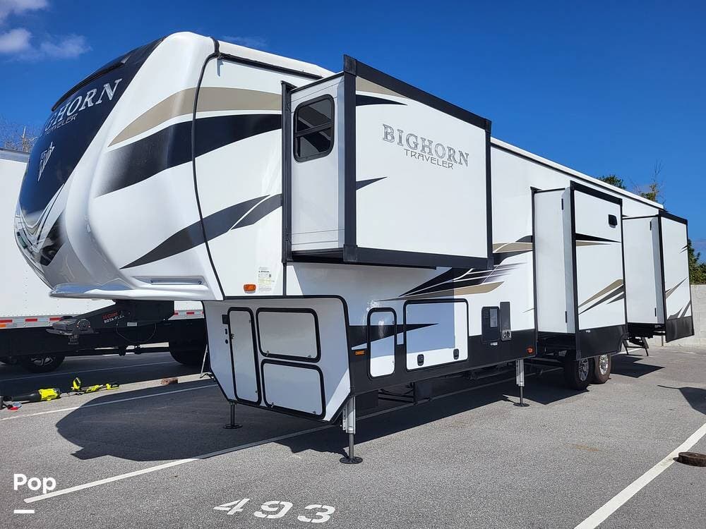 Call now about this 2022 Heartland Bighorn Traveler 37DB! 2022 Heartland Bighorn Traveler 37DB - Used Fifth Wheel For Sale by Pop RVs in Sanford, Florida features Awning, Slideout, Air Conditioning, Leveling Jacks