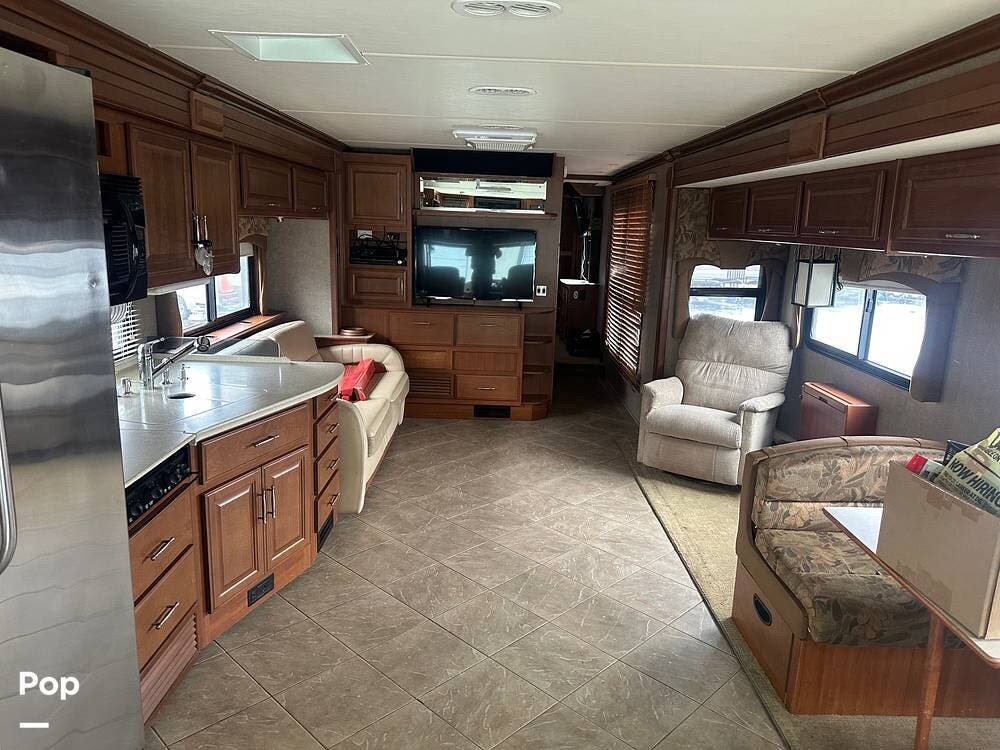 Call now about this 2010 Fleetwood Discovery 40X! 2010 Fleetwood Discovery 40X - Used Diesel Pusher For Sale by Pop RVs in Leesburg, Ohio features Slideout, Leveling Jacks, Awning, Air Conditioning, Generator