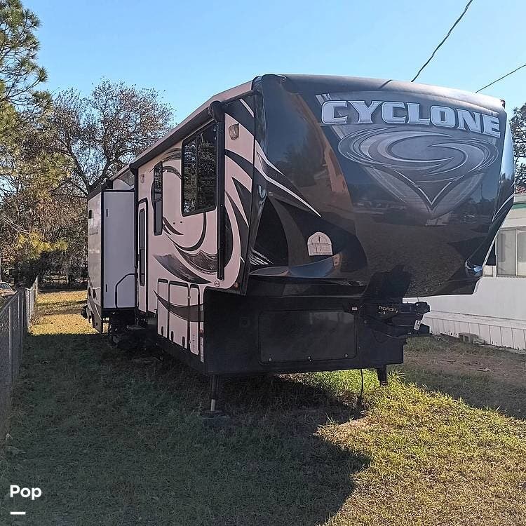 Call now about this 2015 Heartland Cyclone 4100! 2015 Heartland Cyclone 4100 - Used Toy Hauler For Sale by Pop RVs in Hudson, Florida features Awning, Slideout, Leveling Jacks, Air Conditioning, Generator