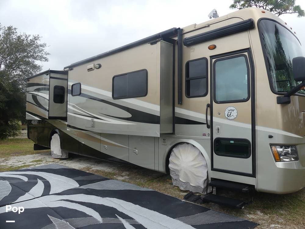 Call now about this 2012 Tiffin Allegro Red 38QRA! 2012 Tiffin Allegro Red 38QRA - Used Diesel Pusher For Sale by Pop RVs in Melbourne, Florida features Generator, Leveling Jacks, Awning, Air Conditioning, Slideout