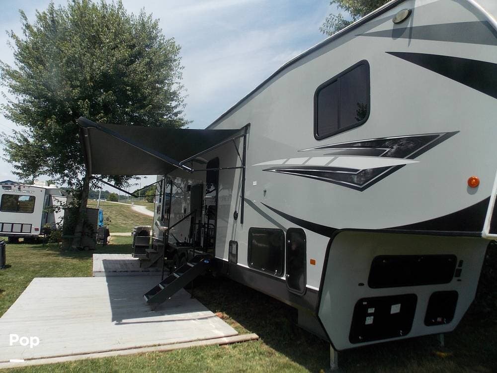 Call now about this 2022 Forest River Wolf Pack 315PACK12! 2022 Forest River Wolf Pack 315PACK12 - Used Toy Hauler For Sale by Pop RVs in Reno, Ohio features Awning, Air Conditioning, Slideout, Leveling Jacks