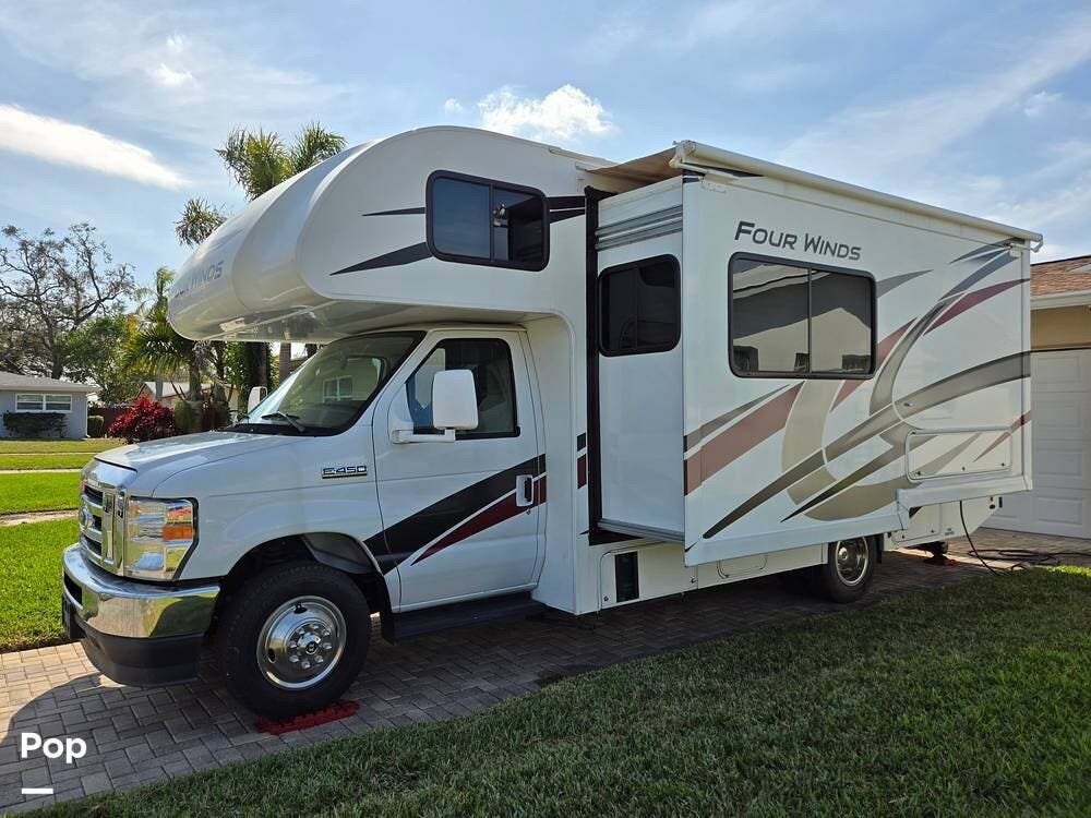 Call now about this 2022 Thor Motor Coach Four Winds 25M! 2022 Thor Motor Coach Four Winds 25M - Used Class C For Sale by Pop RVs in Largo, Florida features Generator, Leveling Jacks, Awning, Air Conditioning, Slideout