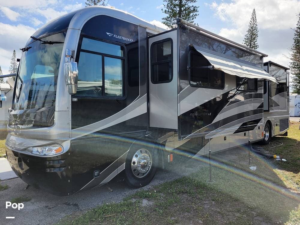 Call now about this 2007 Fleetwood Revolution LE 40E! 2007 Fleetwood Revolution LE 40E - Used Diesel Pusher For Sale by Pop RVs in Deerfield Beach, Florida features Leveling Jacks, Generator, Awning, Air Conditioning, Slideout