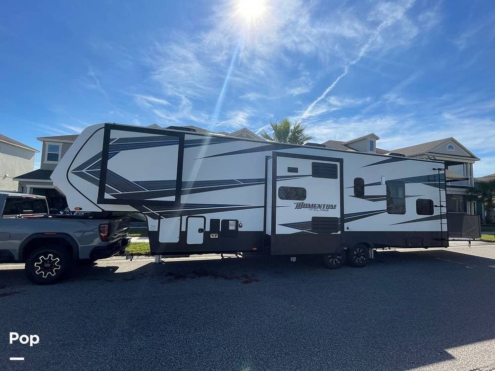 Call now about this 2020 Grand Design Momentum 351! 2020 Grand Design Momentum 351 - Used Toy Hauler For Sale by Pop RVs in Fort Meyers Beach, Florida features Slideout, Leveling Jacks, Generator, Awning, Air Conditioning