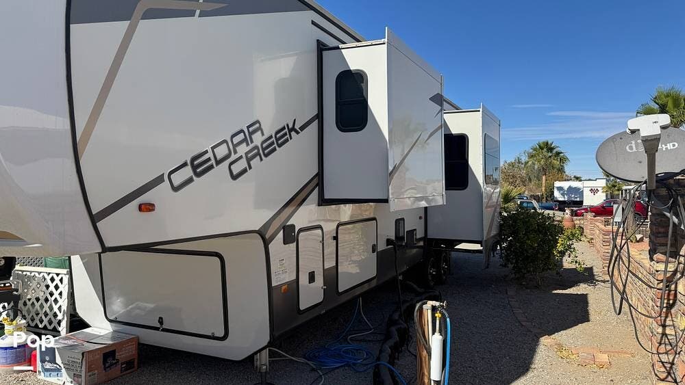 Call now about this 2022 Forest River Cedar Creek 388RK2! 2022 Forest River Cedar Creek 388RK2 - Used Fifth Wheel For Sale by Pop RVs in Yuma, Arizona features Slideout, Awning, Leveling Jacks, Air Conditioning