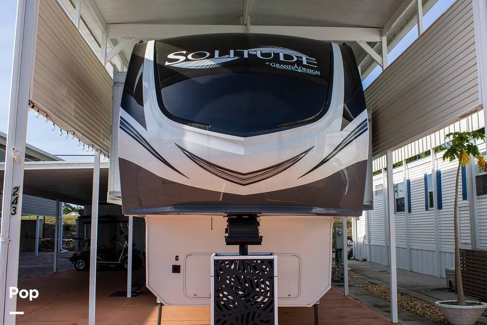 Call now about this 2022 Grand Design Solitude 372WB! 2022 Grand Design Solitude 372WB - Used Fifth Wheel For Sale by Pop RVs in Davenport, Florida features Air Conditioning, Awning, Leveling Jacks, Slideout