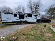 Call now about this 2022 Grand Design Solitude 390RK! 2022 Grand Design Solitude 390RK - Used Fifth Wheel For Sale by Pop RVs in Murfreesboro, Tennessee features Slideout, Leveling Jacks, Awning, Air Conditioning