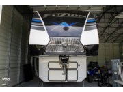Call now about this 2021 Keystone Fuzion 419! 2021 Keystone Fuzion 419 - Used Toy Hauler For Sale by Pop RVs in Lakeland, Florida features Leveling Jacks, Slideout, Generator, Air Conditioning, Awning
