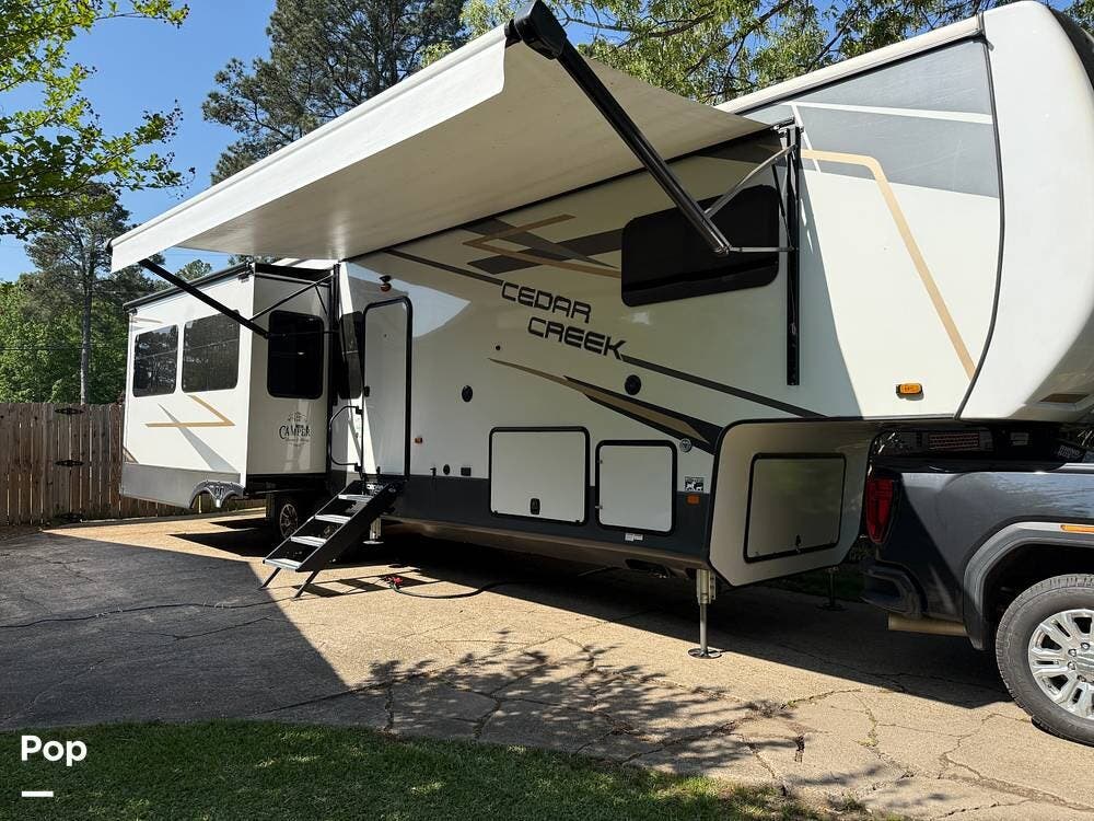 Call now about this 2021 Forest River Cedar Creek 360RL! 2021 Forest River Cedar Creek 360RL - Used Fifth Wheel For Sale by Pop RVs in Texarkana, Arkansas features Slideout, Air Conditioning, Awning, Leveling Jacks