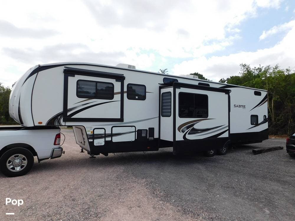 Call now about this 2021 Forest River Sabre 37FLL! 2021 Forest River Sabre 37FLL - Used Fifth Wheel For Sale by Pop RVs in Palm City, Florida features Air Conditioning, Leveling Jacks, Slideout, Awning