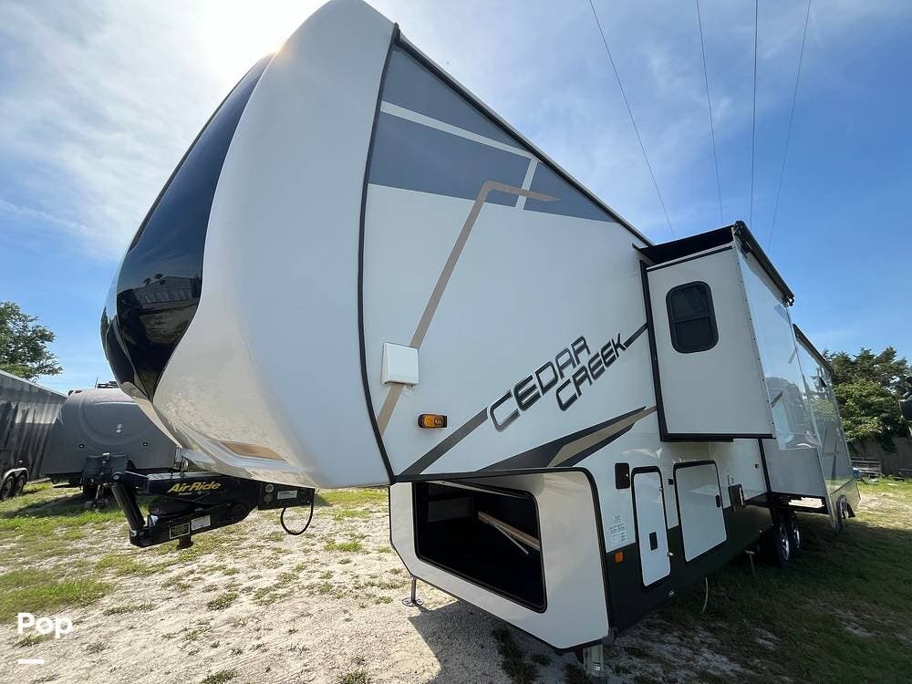 Contact us now about this 2021 Forest River Cedar Creek 388DB! 2021 Cedar Creek 388DB by Forest River from Pop RVs in St Augustine Beach, Florida