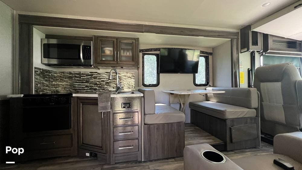 Call now about this 2022 Fleetwood Flair 28A! 2022 Fleetwood Flair 28A - Used Class A For Sale by Pop RVs in New Braunfels, Texas features Generator, Leveling Jacks, Slideout, Air Conditioning, Awning