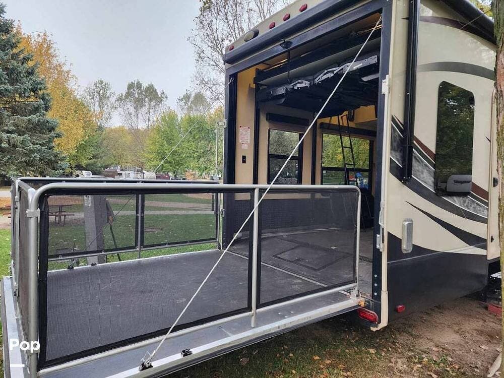 Call now about this 2015 Grand Design Momentum 385TH! 2015 Grand Design Momentum 385TH - Used Toy Hauler For Sale by Pop RVs in Waterford, Wisconsin features Leveling Jacks, Generator, Slideout, Air Conditioning, Awning