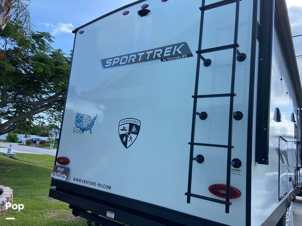 Call now about this 2024 Venture RV SportTrek 271VMB! 2024 Venture RV SportTrek 271VMB - Used Travel Trailer For Sale by Pop RVs in Port Saint Lucie, Florida features Slideout, Awning, Air Conditioning, Leveling Jacks