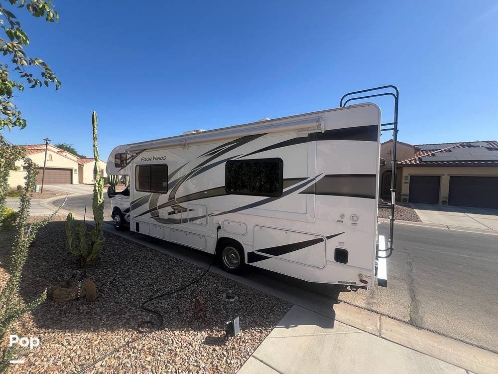 Call now about this 2023 Thor Motor Coach Four Winds 27R! 2023 Thor Motor Coach Four Winds 27R - Used Class C For Sale by Pop RVs in Eloy, Arizona features Air Conditioning, Generator, Awning, Slideout