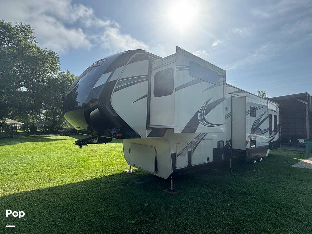Call now about this 2015 Grand Design Momentum 385TH! 2015 Grand Design Momentum 385TH - Used Toy Hauler For Sale by Pop RVs in Raceland, Louisiana features Generator, Air Conditioning, Leveling Jacks, Slideout, Awning