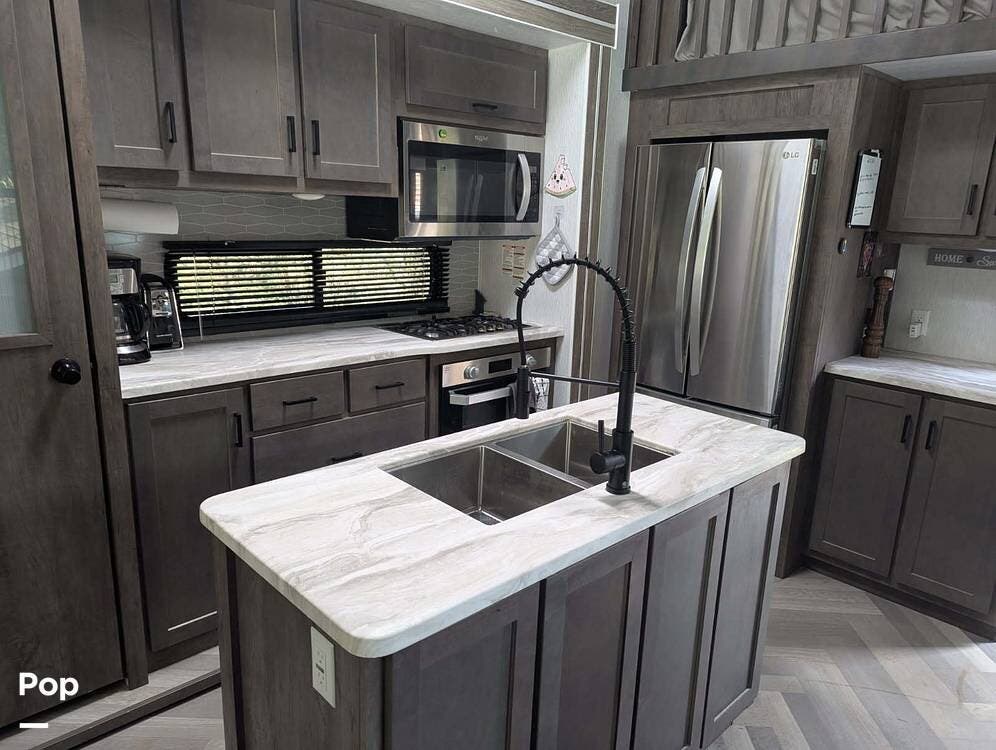 Call now about this 2022 Forest River Wildwood Grand Lodge 42FLDL! 2022 Forest River Wildwood Grand Lodge 42FLDL - Used Travel Trailer For Sale by Pop RVs in Burnsville, North Carolina features Slideout, Leveling Jacks, Air Conditioning, Awning