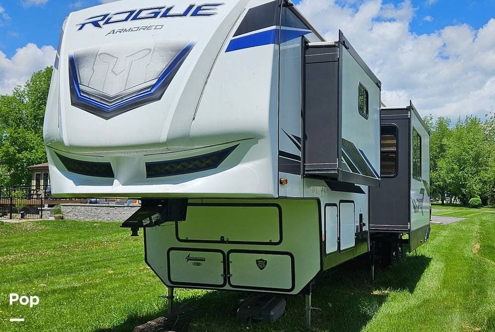 Call now about this 2023 Forest River Rogue Armored 371A13! 2023 Forest River Rogue Armored 371A13 - Used Toy Hauler For Sale by Pop RVs in Cortland, New York features Air Conditioning, Leveling Jacks, Generator, Slideout, Awning