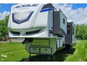 Call now about this 2023 Forest River Rogue Armored 371A13! 2023 Forest River Rogue Armored 371A13 - Used Toy Hauler For Sale by Pop RVs in Cortland, New York features Air Conditioning, Leveling Jacks, Generator, Slideout, Awning