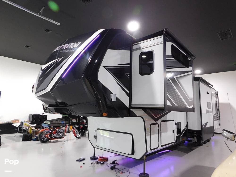 Call now about this 2023 Grand Design Momentum 397THS! 2023 Grand Design Momentum 397THS - Used Toy Hauler For Sale by Pop RVs in Palm City, Florida features Generator, Leveling Jacks, Air Conditioning, Slideout, Awning