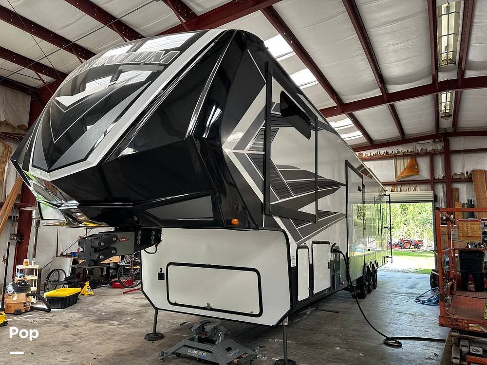 Call now about this 2020 Grand Design Momentum 397TH! 2020 Grand Design Momentum 397TH - Used Toy Hauler For Sale by Pop RVs in Sarasota, Florida features Generator, Leveling Jacks, Air Conditioning, Slideout, Awning