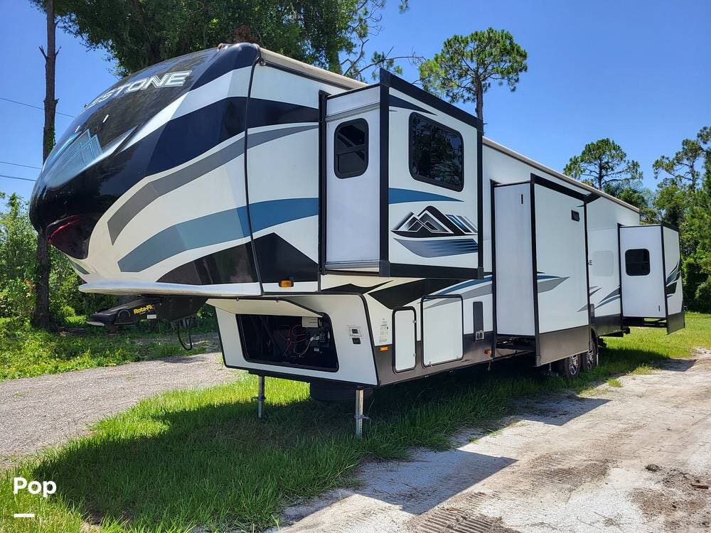 Call now about this 2021 Heartland Milestone 370FLMB! 2021 Heartland Milestone 370FLMB - Used Fifth Wheel For Sale by Pop RVs in Orlando, Florida features Leveling Jacks, Air Conditioning, Slideout, Awning