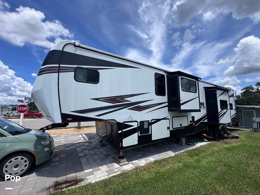 Call now about this 2021 Forest River XLR Nitro 407! 2021 Forest River XLR Nitro 407 - Used Toy Hauler For Sale by Pop RVs in Zephyrhills, Florida features Generator, Awning, Air Conditioning, Leveling Jacks, Slideout