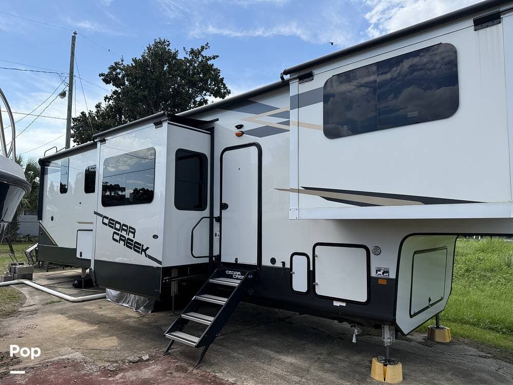 Contact us now about this 2021 Forest River Cedar Creek 371FL! 2021 Cedar Creek 371FL by Forest River from Pop RVs in Pensacola, Florida
