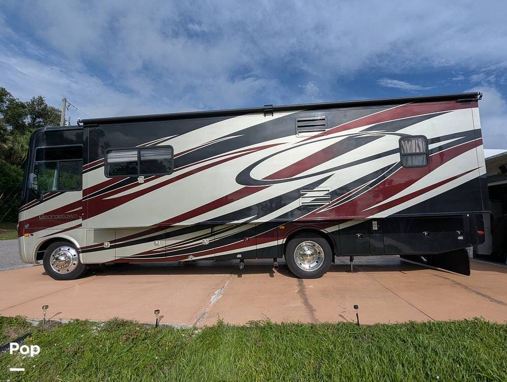 Call now about this 2012 Forest River Georgetown 337DS! 2012 Forest River Georgetown 337DS - Used Class A For Sale by Pop RVs in North Port, Florida features Leveling Jacks, Air Conditioning, Awning, Generator, Slideout