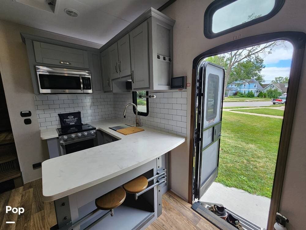 Call now about this 2019 Keystone Fuzion 369! 2019 Keystone Fuzion 369 - Used Toy Hauler For Sale by Pop RVs in Astoria, Illinois features Air Conditioning, Generator, Slideout, Awning, Leveling Jacks