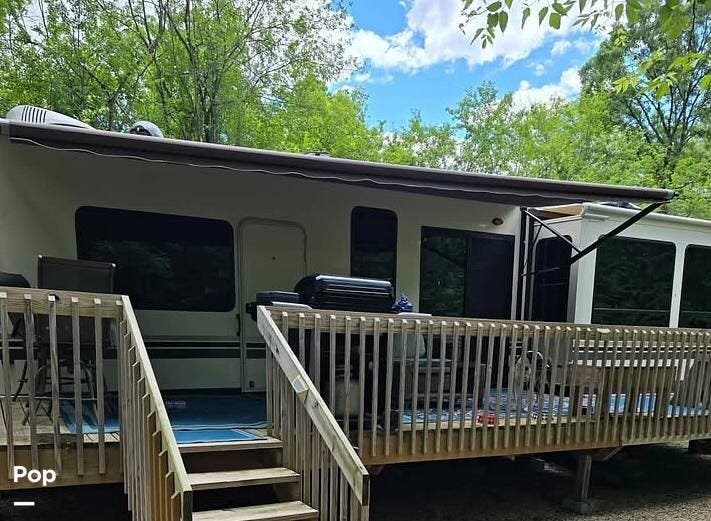 Call now about this 2018 Forest River Cedar Creek 40CFE2! 2018 Forest River Cedar Creek 40CFE2 - Used Travel Trailer For Sale by Pop RVs in Delavan, Wisconsin features Air Conditioning, Awning, Slideout