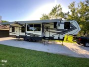 Call now about this 2020 Grand Design Momentum 381M! 2020 Grand Design Momentum 381M - Used Toy Hauler For Sale by Pop RVs in Stuart, Florida features Awning, Leveling Jacks, Air Conditioning, Slideout, Generator