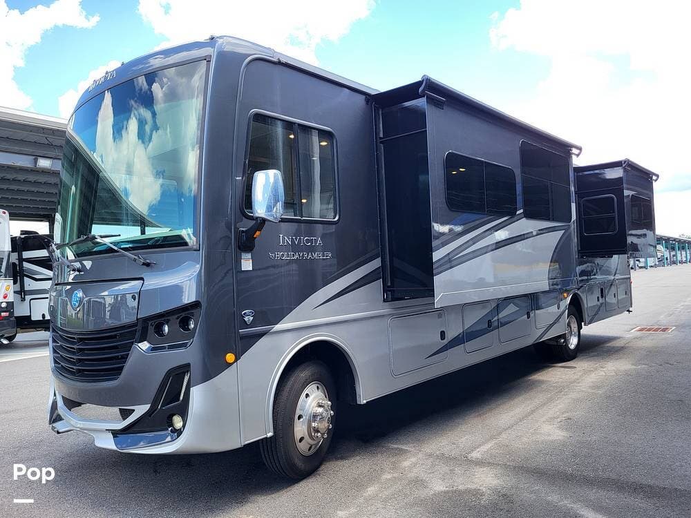 Call now about this 2021 Holiday Rambler Invicta 36DB! 2021 Holiday Rambler Invicta 36DB - Used Class A For Sale by Pop RVs in Tavares, Florida features Air Conditioning, Awning, Generator, Slideout, Leveling Jacks