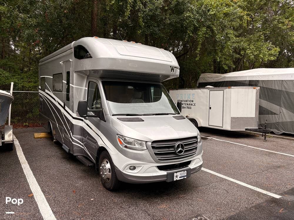 Call now about this 2023 Winnebago Navion 24V! 2023 Winnebago Navion 24V - Used Class C For Sale by Pop RVs in Hilton Head Island, South Carolina features Generator, Leveling Jacks, Air Conditioning, Awning, Slideout
