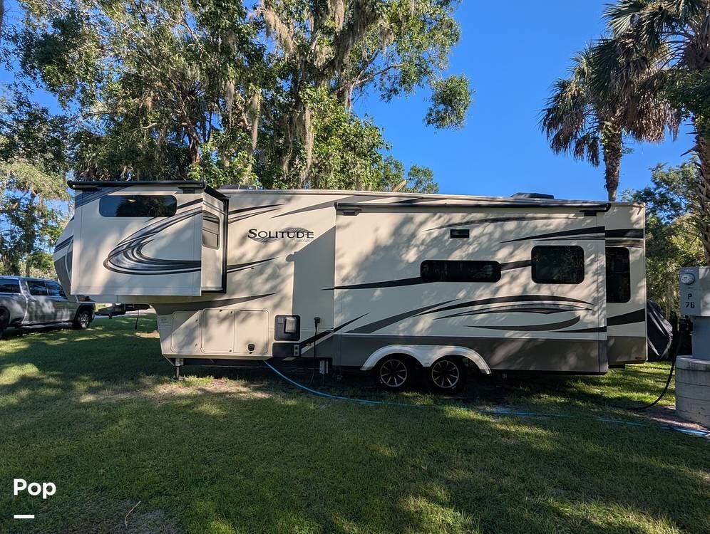 Call now about this 2021 Grand Design Solitude 310GK! 2021 Grand Design Solitude 310GK - Used Fifth Wheel For Sale by Pop RVs in Wauchula, Florida features Air Conditioning, Slideout, Awning