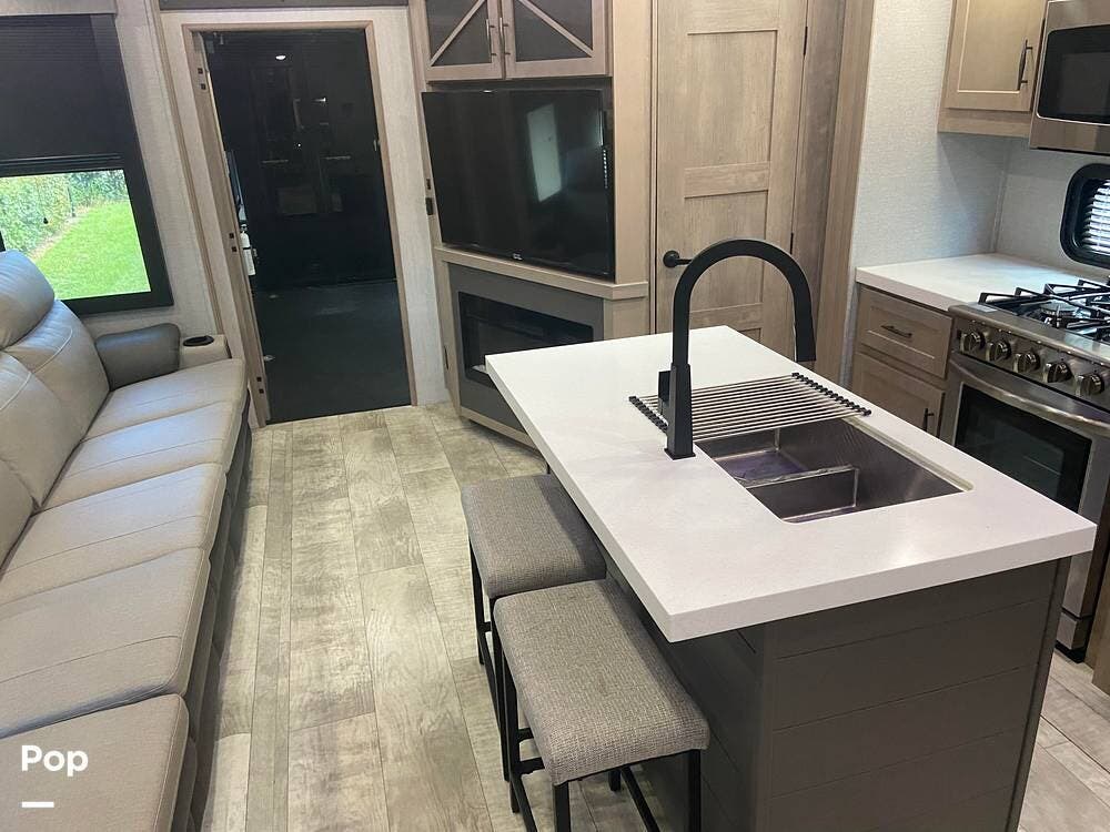 Call now about this 2023 Grand Design Momentum 397TH! 2023 Grand Design Momentum 397TH - Used Toy Hauler For Sale by Pop RVs in Port Saint Lucie, Florida features Leveling Jacks, Air Conditioning, Slideout, Awning, Generator