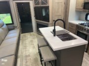 Call now about this 2023 Grand Design Momentum 397TH! 2023 Grand Design Momentum 397TH - Used Toy Hauler For Sale by Pop RVs in Port Saint Lucie, Florida features Leveling Jacks, Air Conditioning, Slideout, Awning, Generator