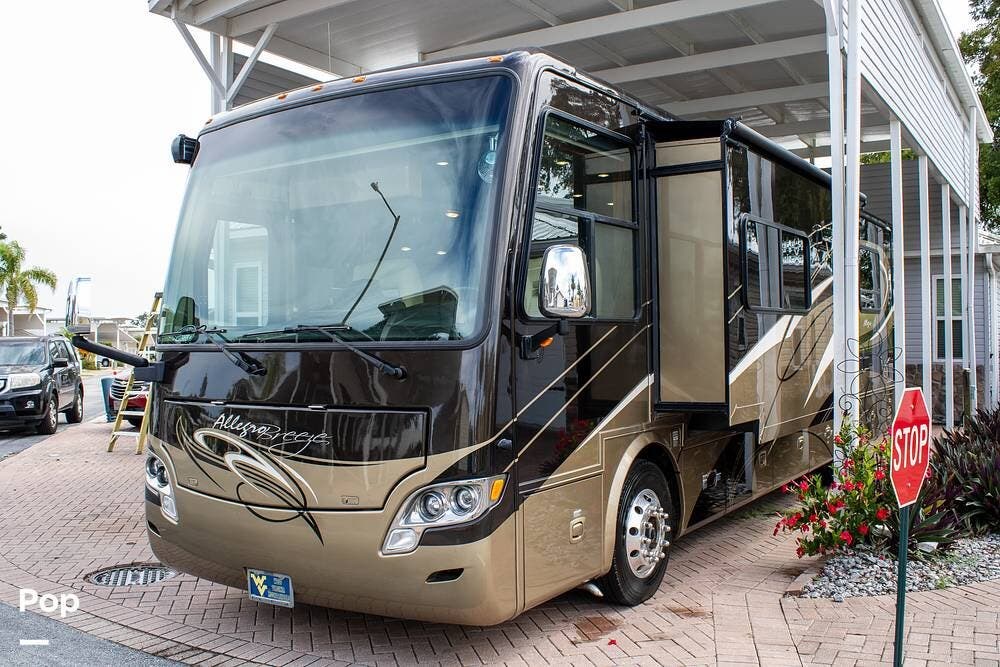Contact us now about this 2012 Tiffin Allegro Breeze 32BR! 2012 Allegro Breeze 32BR by Tiffin from Pop RVs in Davenport, Florida