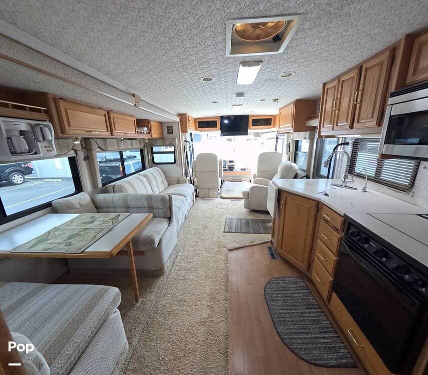 Call now about this 2003 Winnebago Adventurer 33V! 2003 Winnebago Adventurer 33V - Used Class A For Sale by Pop RVs in San Dimas, California features Awning, Leveling Jacks, Slideout, Generator, Air Conditioning