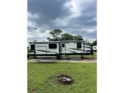Call now about this 2021 Keystone Outback 330RL! 2021 Keystone Outback 330RL - Used Travel Trailer For Sale by Pop RVs in Salina, Kansas features Air Conditioning, Leveling Jacks, Slideout, Awning