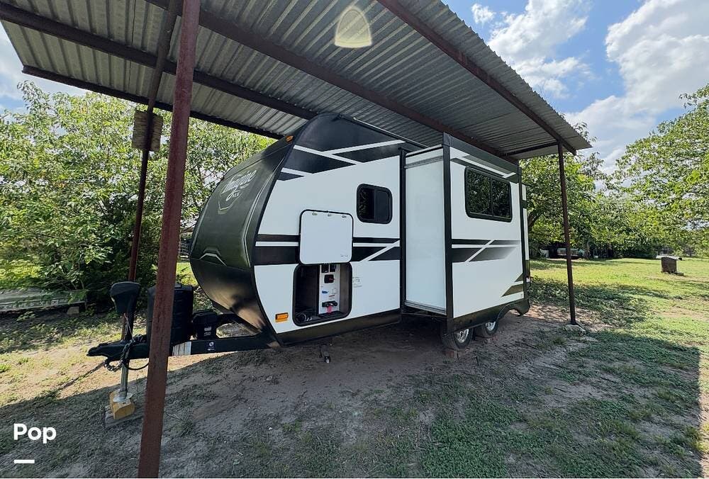 Call now about this 2021 Grand Design Imagine XLS 17MKE! 2021 Grand Design Imagine XLS 17MKE - Used Travel Trailer For Sale by Pop RVs in Bertram, Texas features Slideout, Leveling Jacks, Air Conditioning, Awning