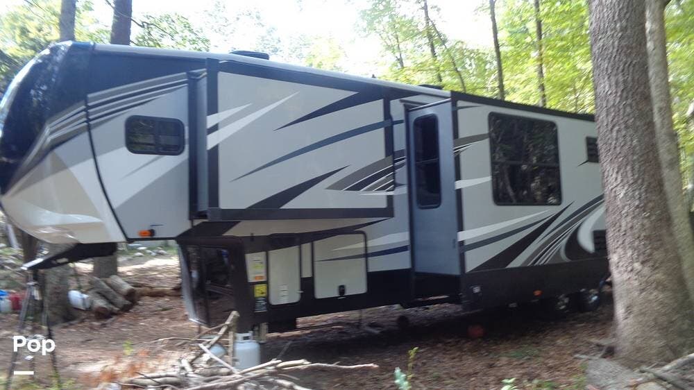 Call now about this 2020 Heartland Cyclone 3713! 2020 Heartland Cyclone 3713 - Used Toy Hauler For Sale by Pop RVs in Chepachet, Rhode Island features Leveling Jacks, Slideout, Generator, Air Conditioning, Awning
