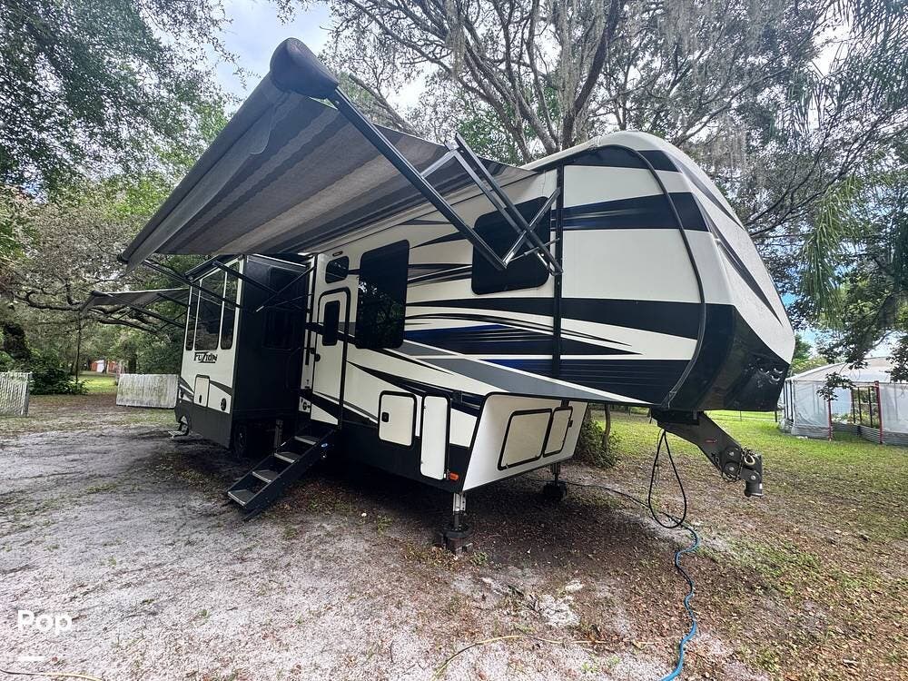 Call now about this 2019 Keystone Fuzion 373! 2019 Keystone Fuzion 373 - Used Toy Hauler For Sale by Pop RVs in Hudson, Florida features Leveling Jacks, Generator, Slideout, Air Conditioning, Awning