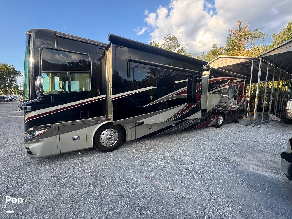 Call now about this 2015 Tiffin Phaeton 40AH! 2015 Tiffin Phaeton 40AH - Used Diesel Pusher For Sale by Pop RVs in Nashville, Tennessee features Air Conditioning, Generator, Awning, Slideout, Leveling Jacks