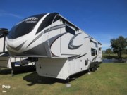 Call now about this 2021 Grand Design Solitude 390RK! 2021 Grand Design Solitude 390RK - Used Fifth Wheel For Sale by Pop RVs in Dover, Florida features Generator, Awning, Leveling Jacks, Slideout, Air Conditioning